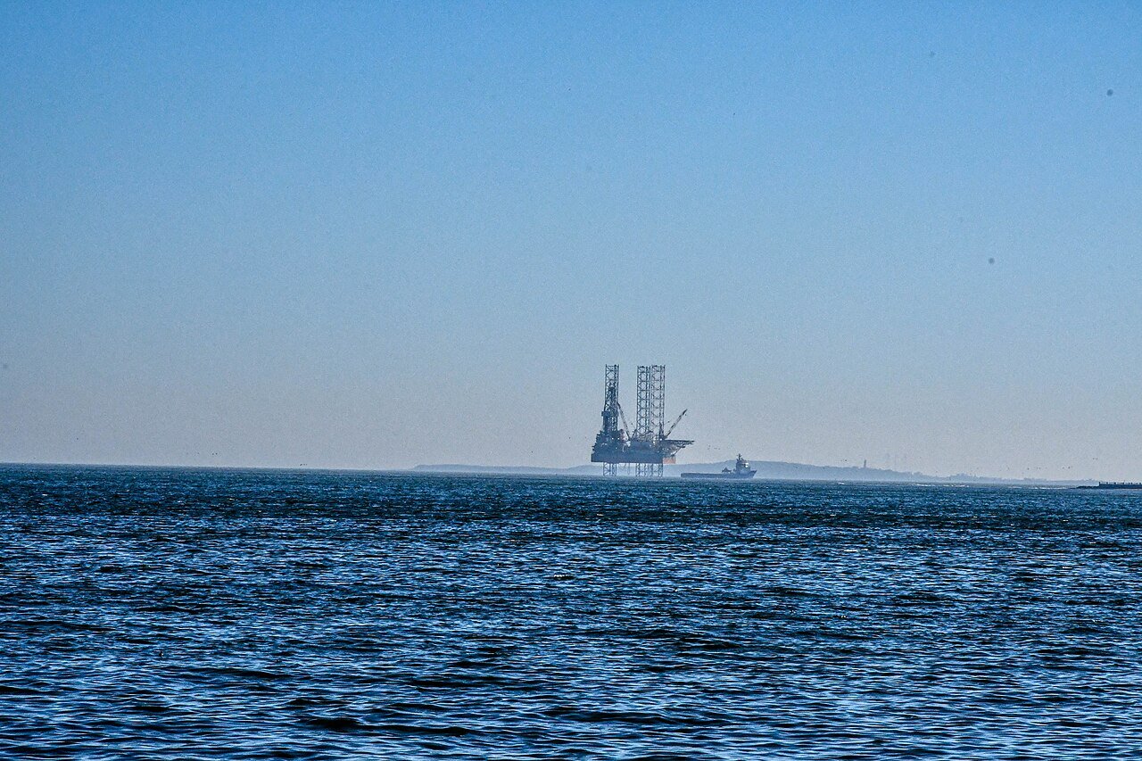 Offshore oil platform with process facilities — remote and offshore assets require tender provisions for aviation, vessel and camp logistics